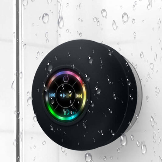 Waterproof LED Bluetooth speaker with suction cup, ideal for showers and outdoor use, featuring colorful light effects.